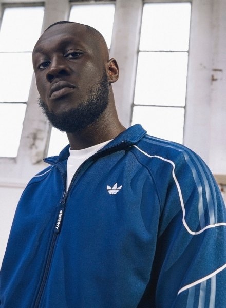 stormzy in blue SPRT track top